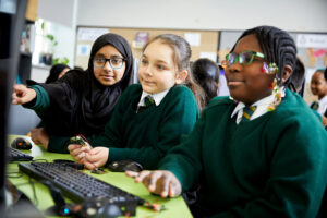 children using micro:bit devices at school
