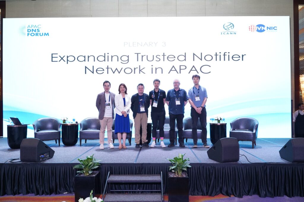 Nominet, Taiwan Network Information Center (TWNIC) and DotAsia Organisation (DotAsia) representatives standing together united after signing a memorandum of understanding (MoU) to join the APAC Trusted Notifier Network